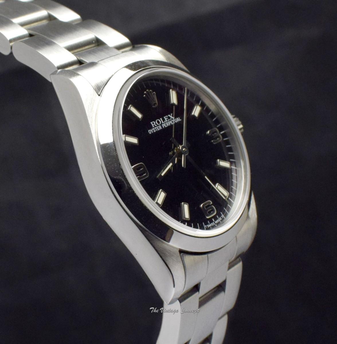 Rolex Steel Oyster Perpetual Black 3,6,9 Dial 67480  (SOLD)