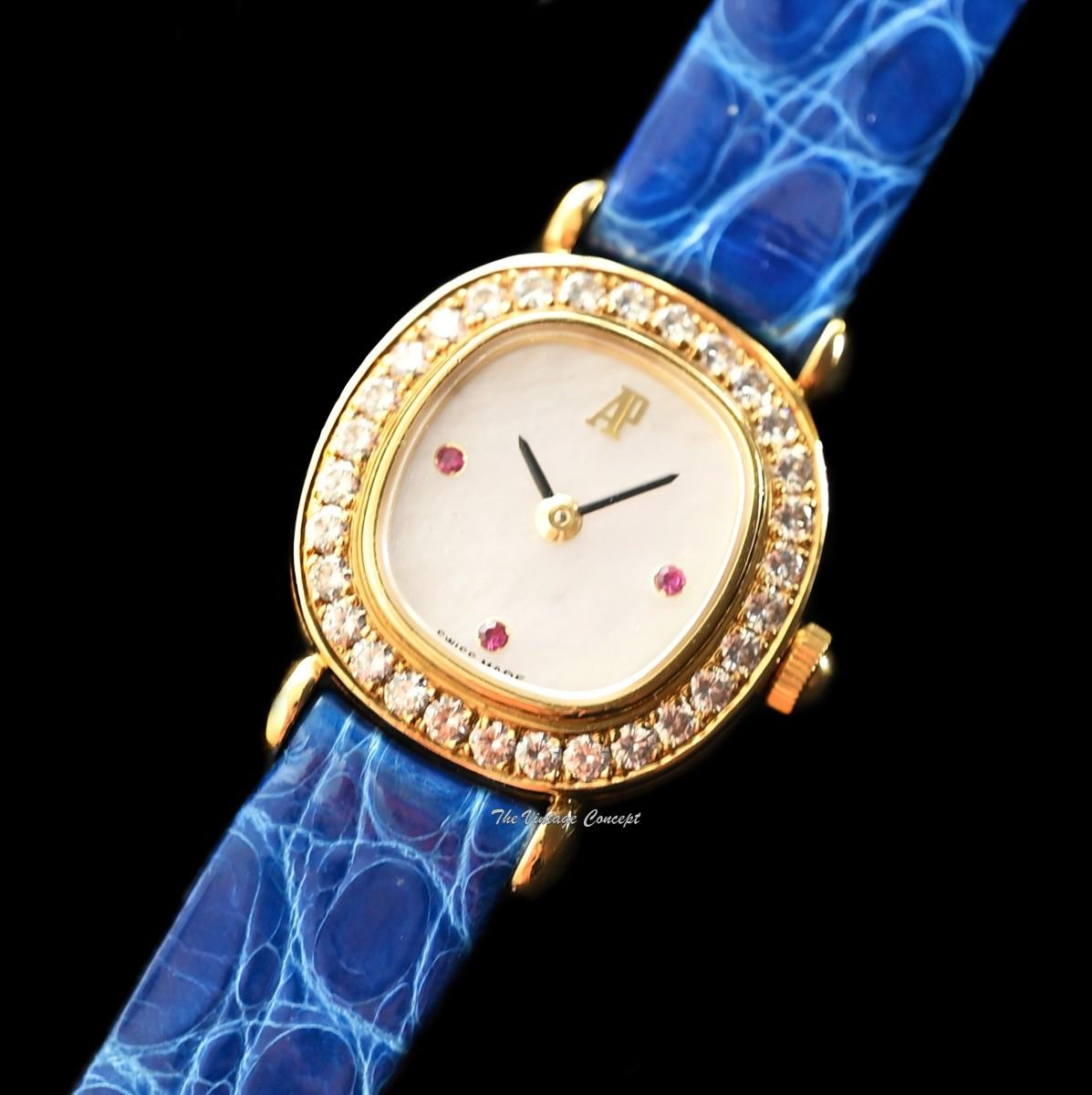 Audemars Piguet Lady 18K Yellow Gold Mother of Pearl Dial Ruby Indexes Diamonds Manual 77150BA w/ Original Paper  (SOLD)