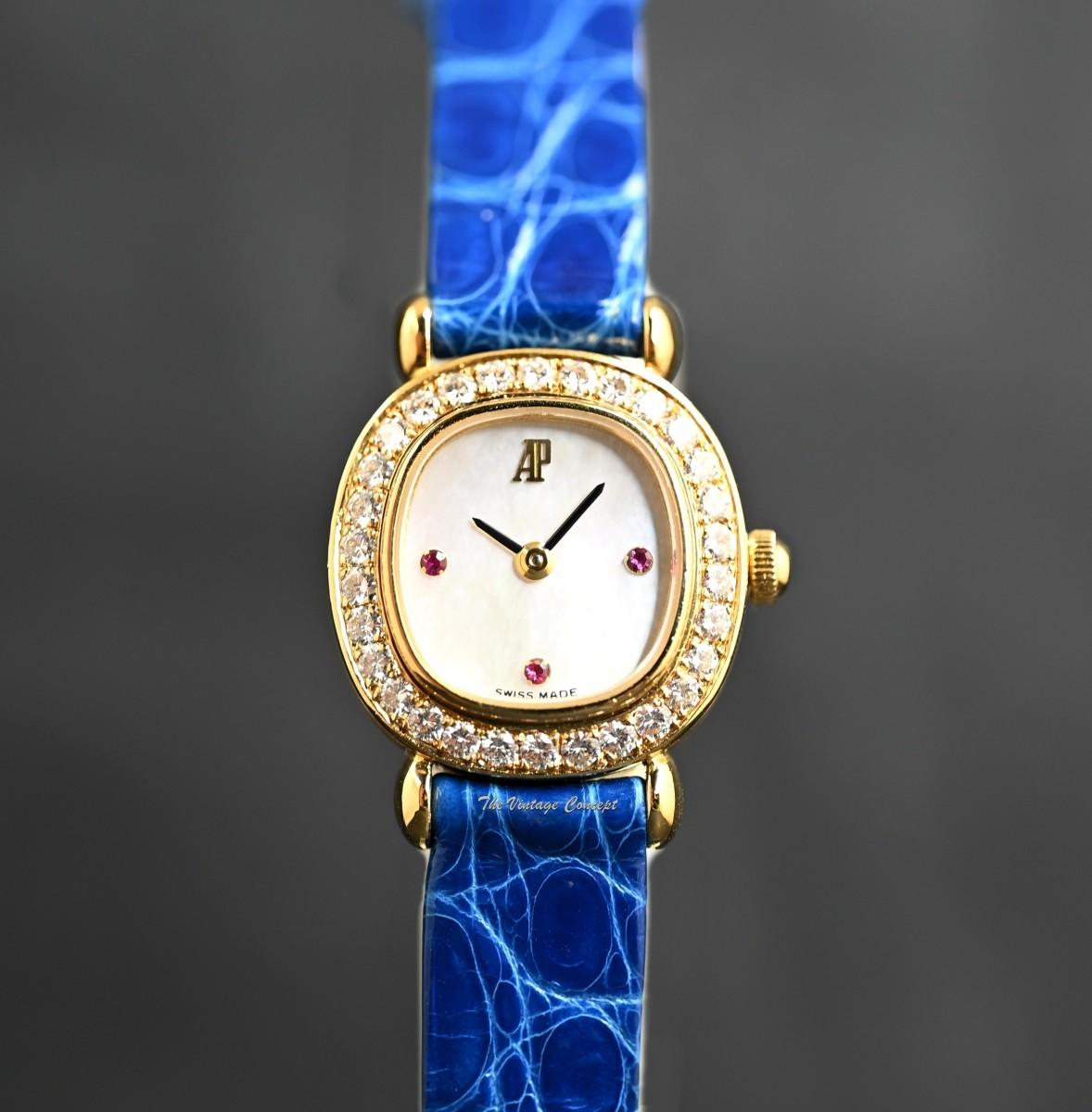 Audemars Piguet Lady 18K Yellow Gold Mother of Pearl Dial Ruby Indexes Diamonds Manual 77150BA w/ Original Paper  (SOLD)