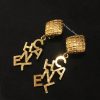 Chanel Gold Tone Diamond Shape Dangle C-H-A-N-E-L Clip Earring from 80’s (SOLD)