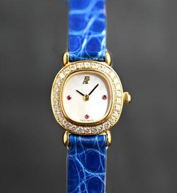 Audemars Piguet Lady 18K Yellow Gold Mother of Pearl Dial Ruby Indexes Diamonds Manual 77150BA w/ Original Paper (SOLD) - The Vintage Concept